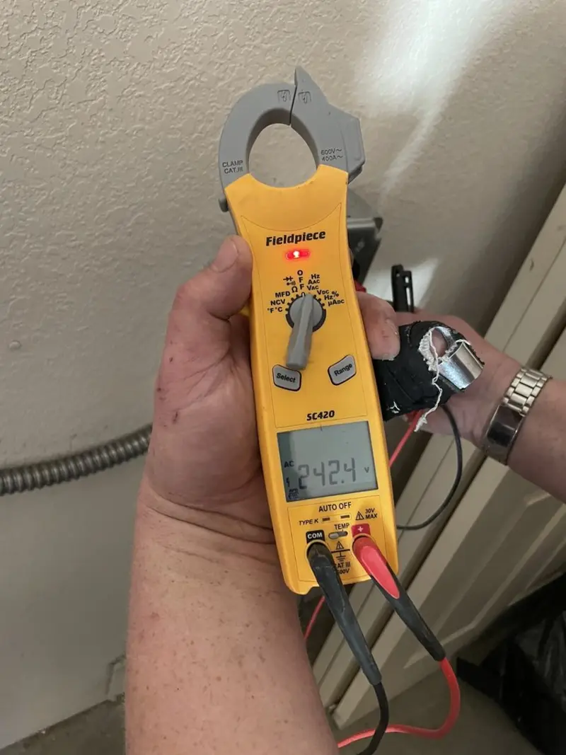 Voltage testing with clamp meter during Outlet Installation in Merrifield